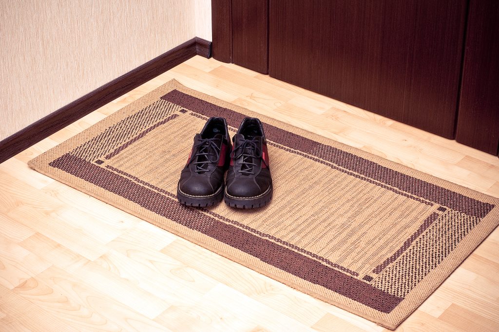 integrated door mats - boots on the door-mat at the entrance