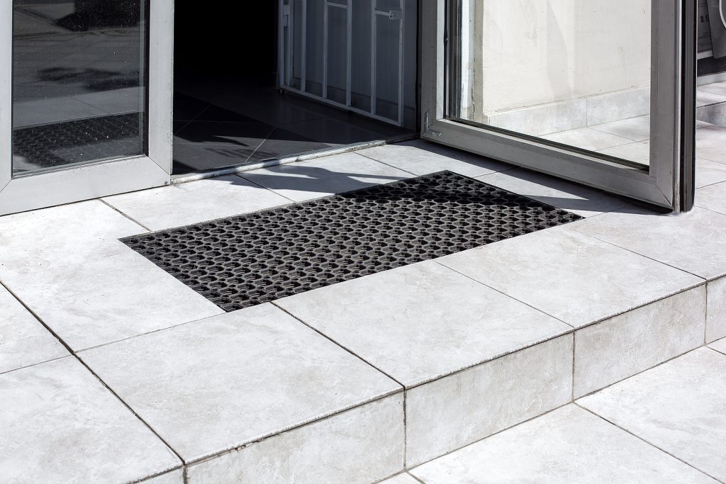 EMCO entrance matting - threshold made of light gray ceramic tiles